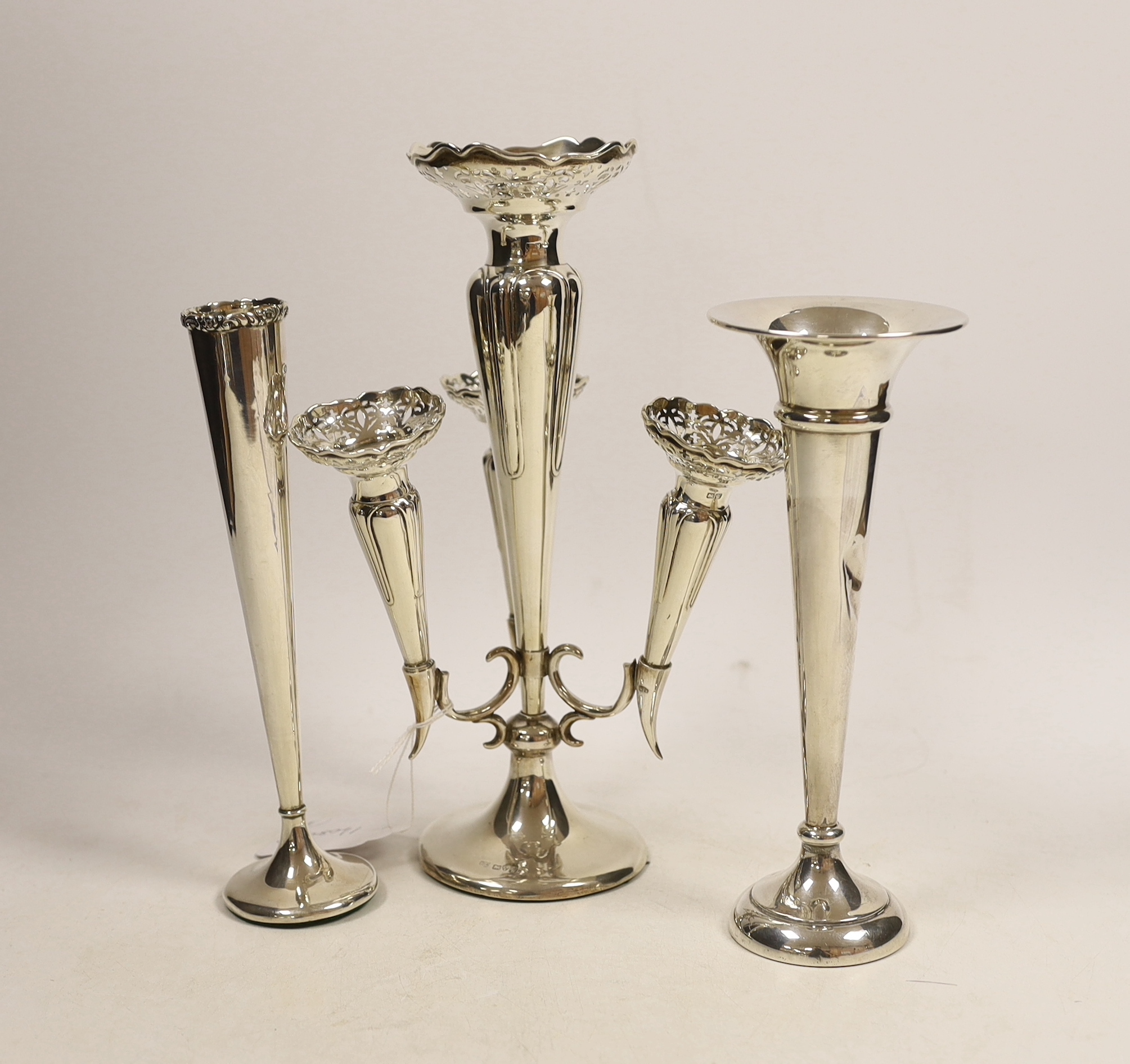 A George V silver centrepiece with four receivers, Colen Hewer Cheshire, Chester, 1920, height 25.7cm, weighted, together with two silver posy vases.